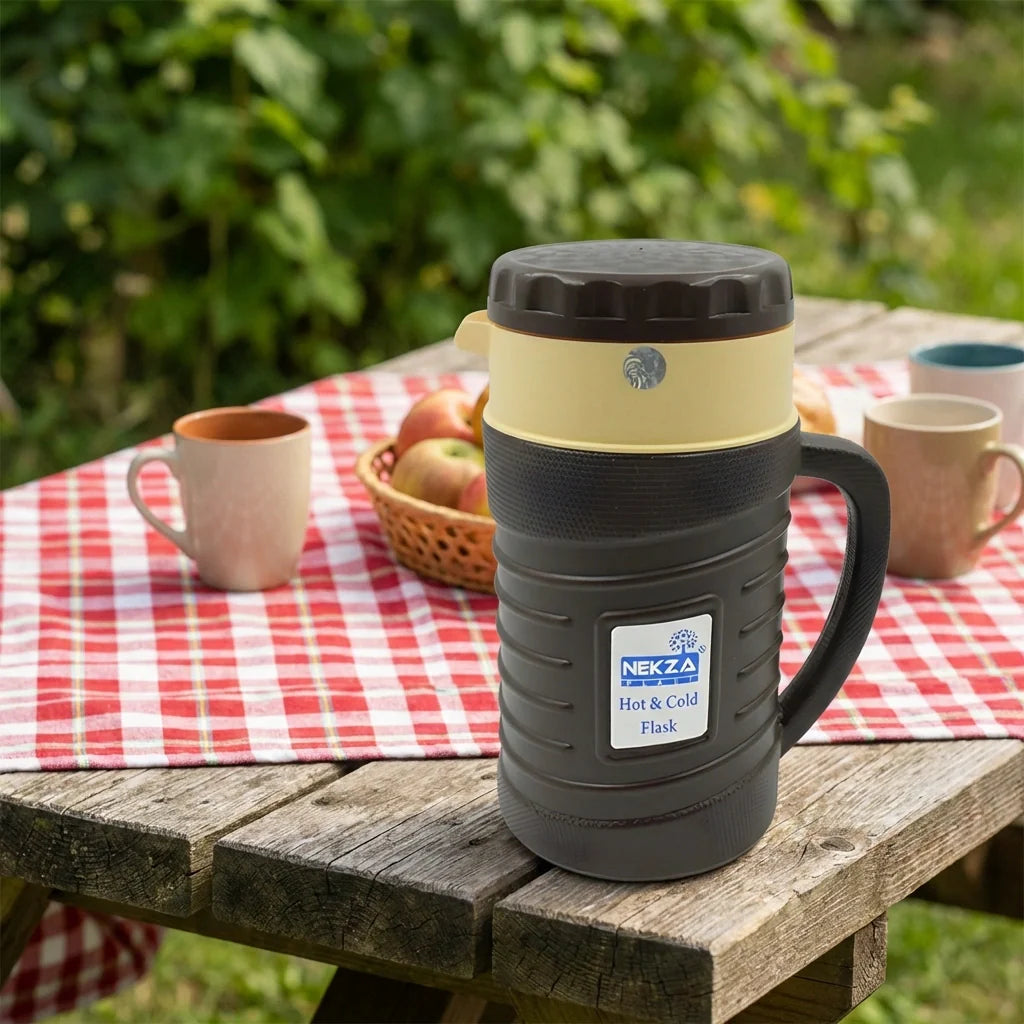 Insulated flask kettle thermos with handle, dark body, and beige rim on table