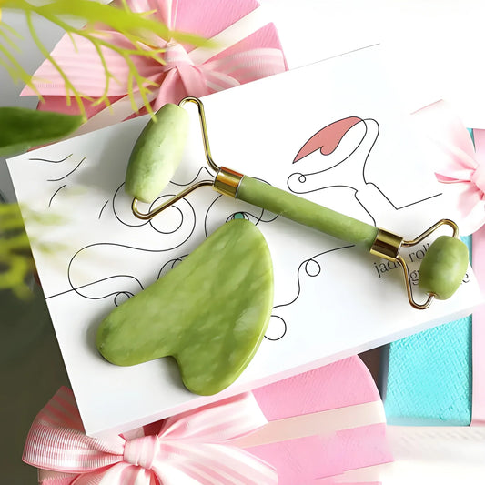 Jade roller and gua sha set with green stone facial tools, including two roller handles