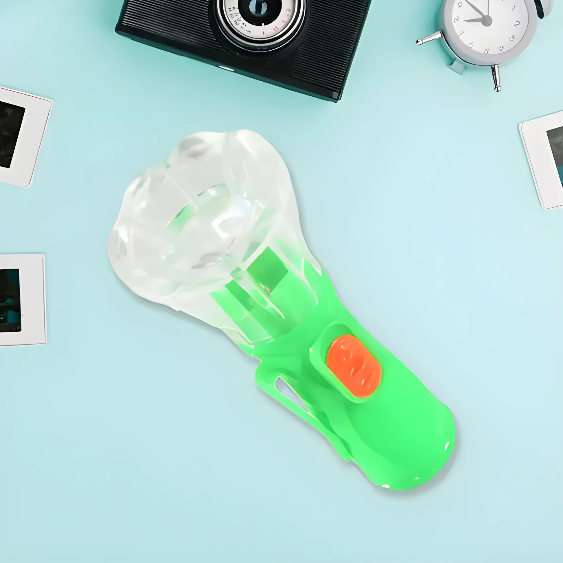Kids explorer flashlight with green translucent handle and orange button