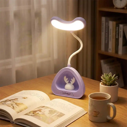 LED desk reading lamp, purple triangular base with bunny icon and lit white neck