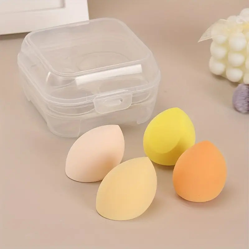 Makeup sponge set with yellow, orange, and white teardrop sponges in clear case