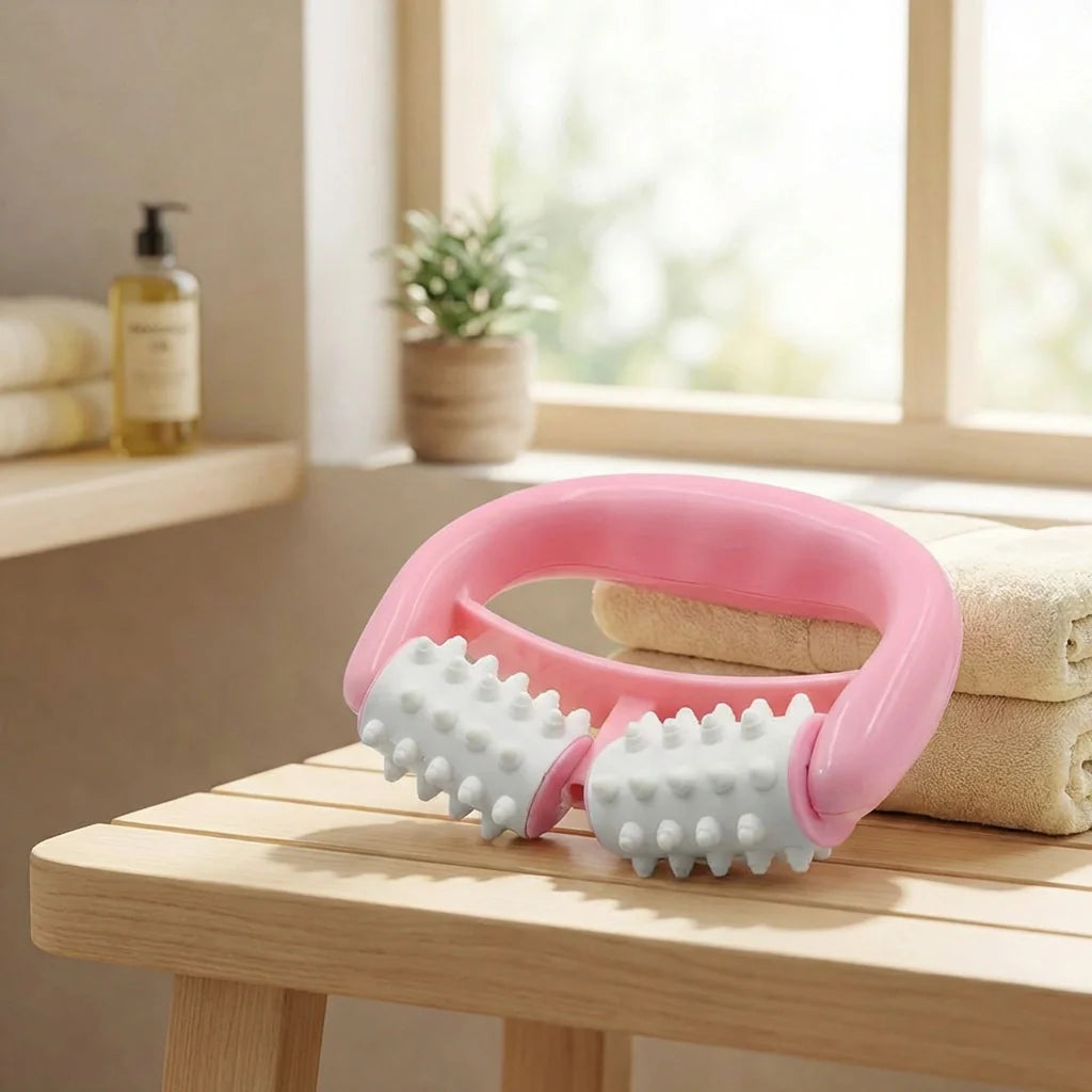 Pink massage roller tool with two spiked wheels and curved handle
