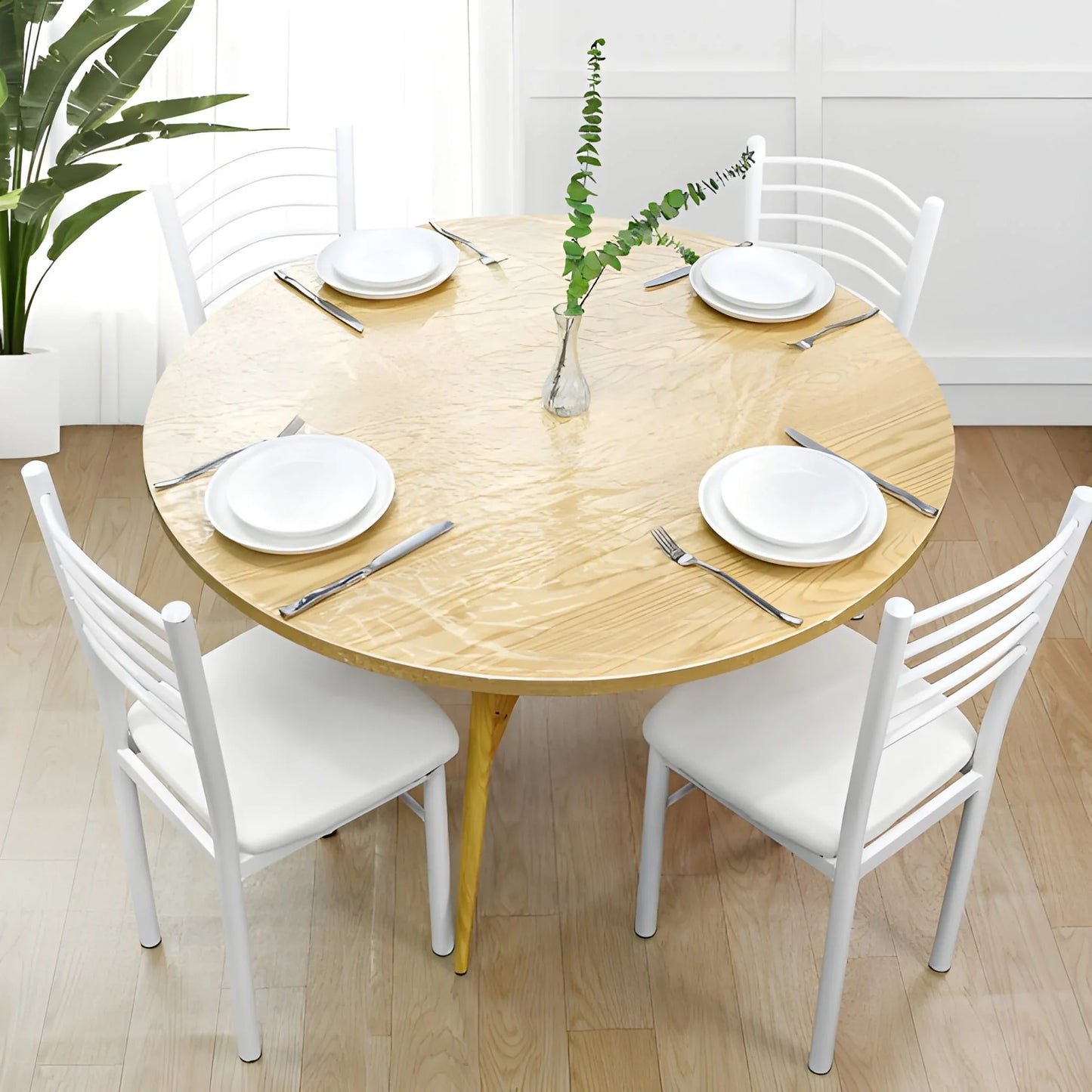 Round elastic table cover in beige, fitted over dining table