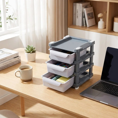 3-layer drawer organizer with three stacked gray-and-white drawers and a lidded top tray