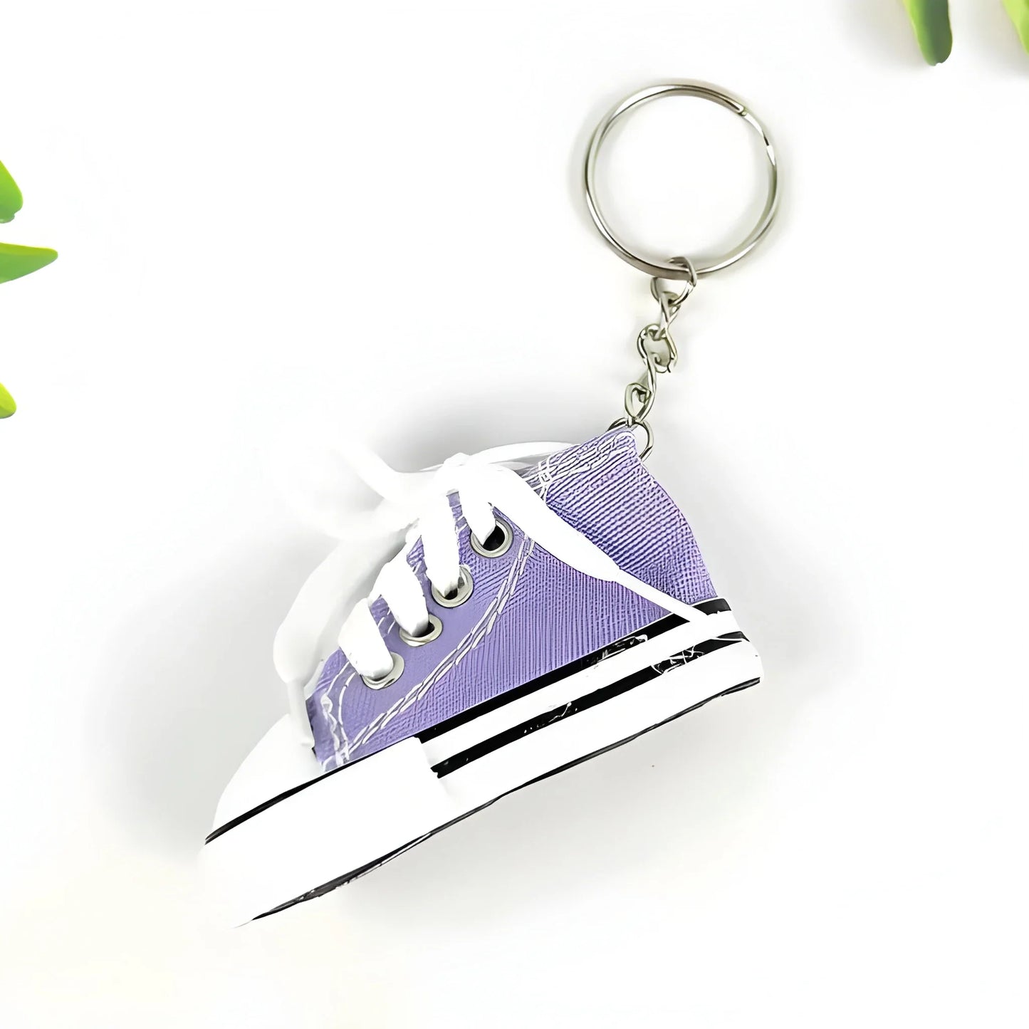 Purple mini sneaker keychain with metal keyring and white laces