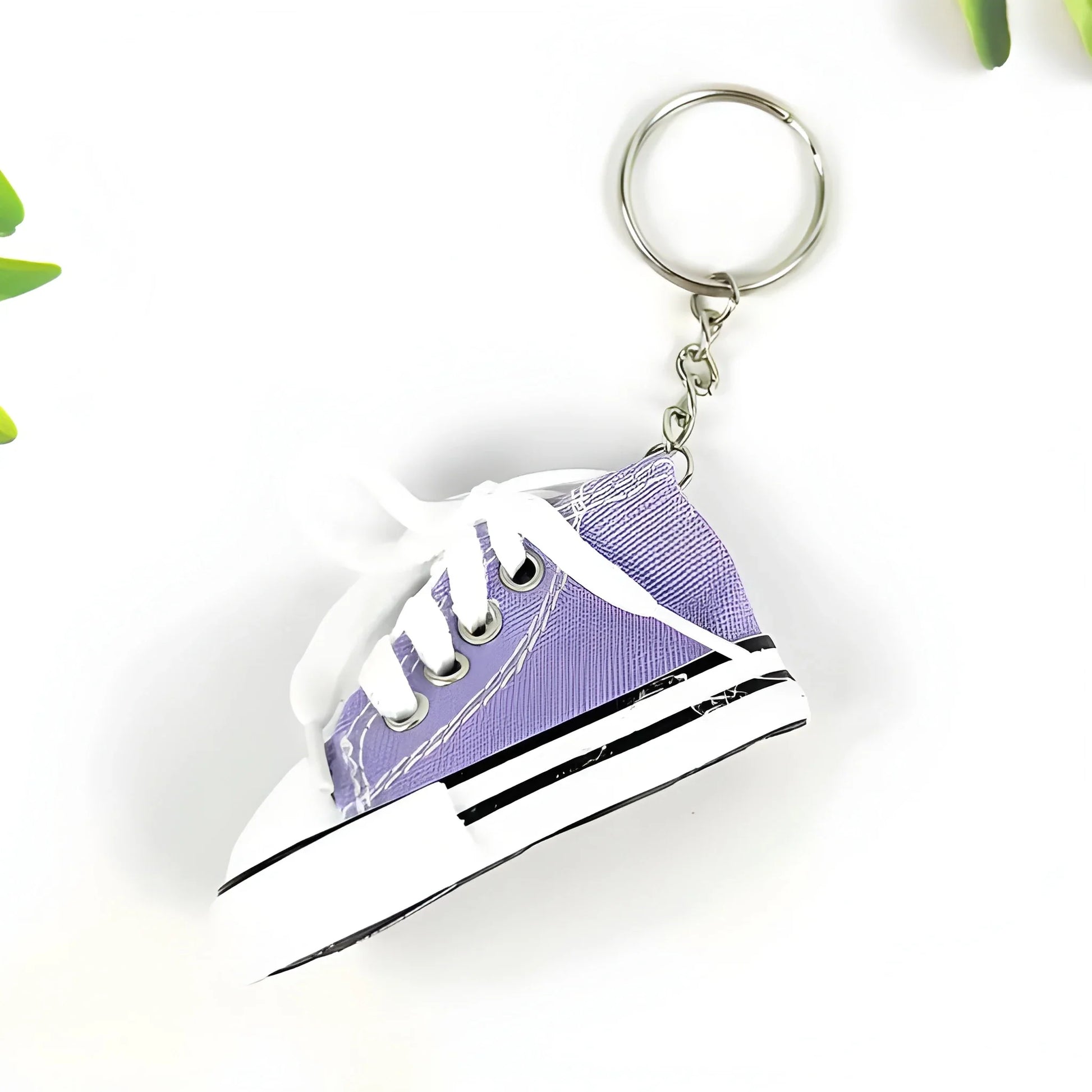 Purple mini sneaker keychain with metal keyring and white laces