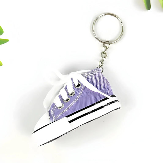 Purple mini sneaker keychain with metal keyring and white laces