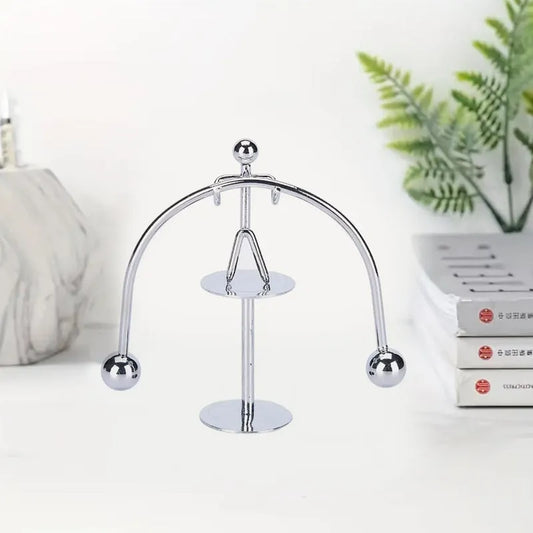 Mini steel balance toy with arched frame and two hanging metal balls