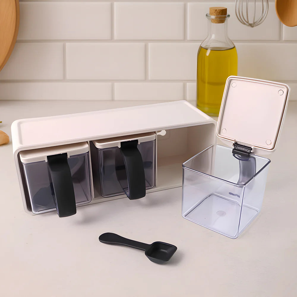 Modular spice box with open compartments, clear drawers, and black measuring scoop
