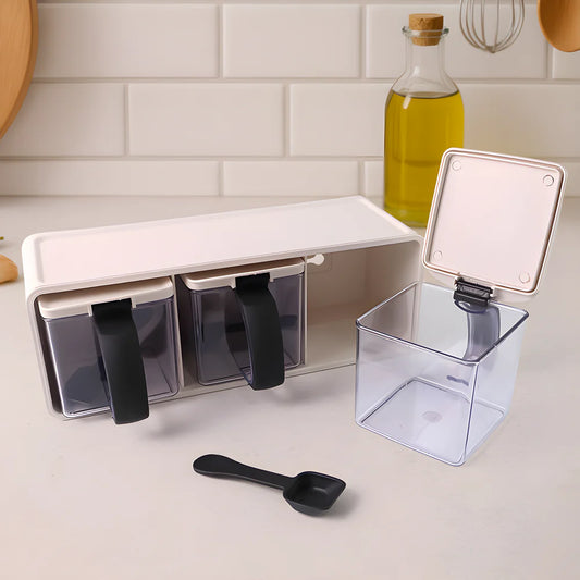 Modular spice box with open compartments, clear drawers, and black measuring scoop