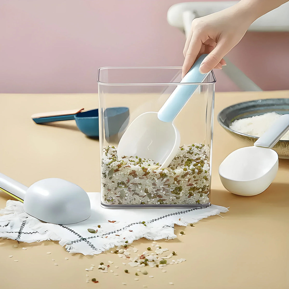 Measuring scoop with light blue handle and white bowl for portioning