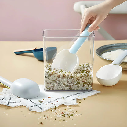 Measuring scoop with light blue handle and white bowl for portioning