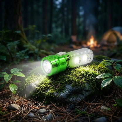 Green multi-LED torchlight with white lanyard on mossy surface, front beam