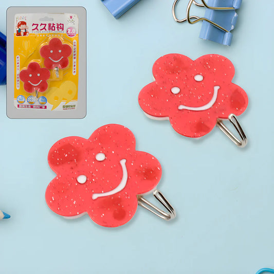 Red flower-shaped wall hook with metal keyhole clip, two hooks shown