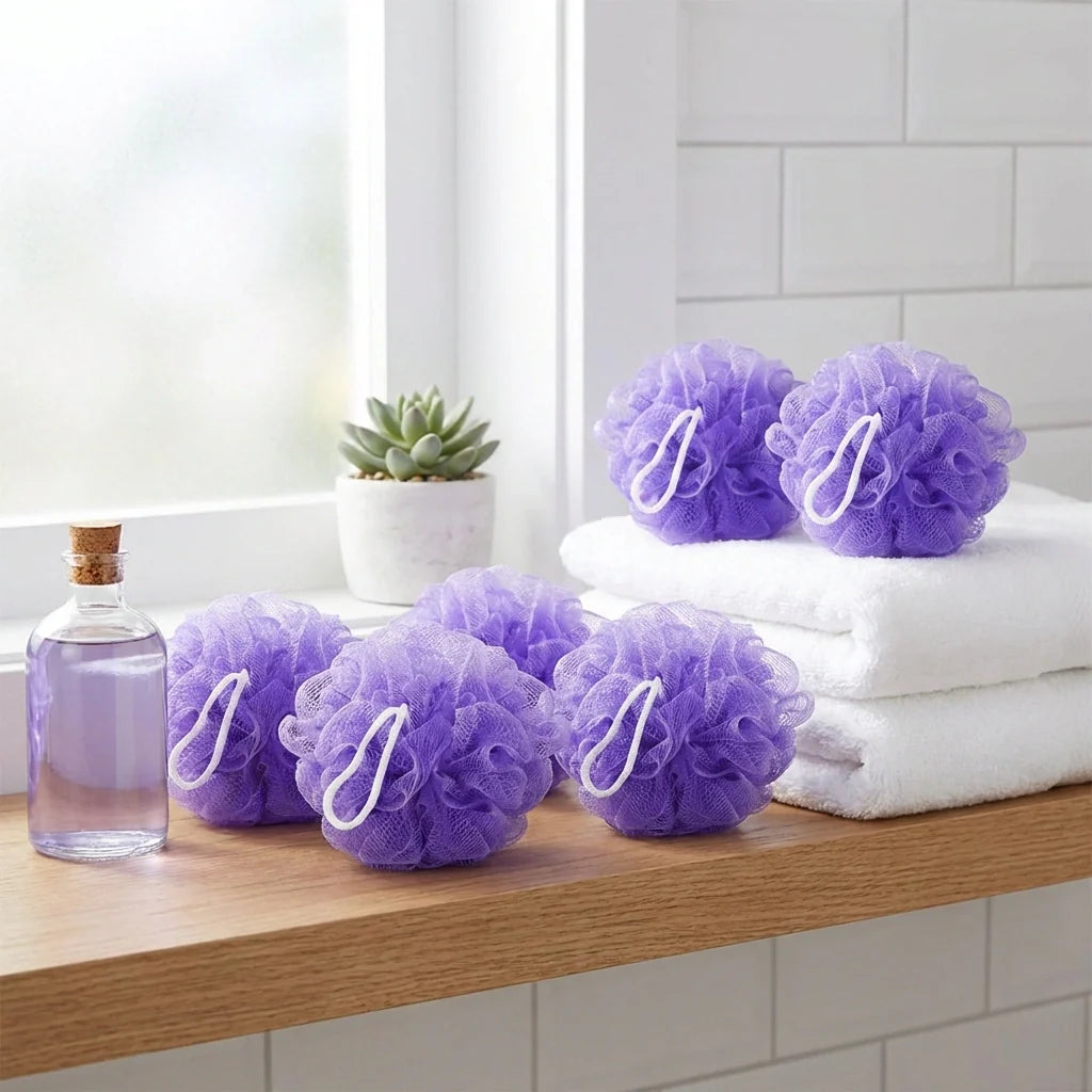 Purple bath loofahs, sponge-like mesh scrub pads in a set