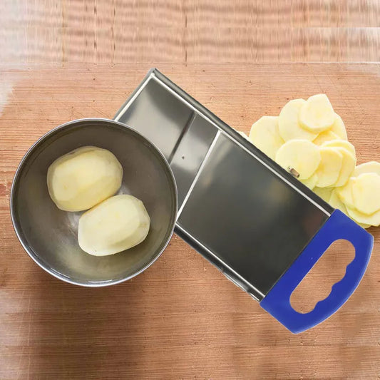 Potato slicer with bowl and blade, holding pale potato slices