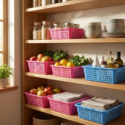 Plastic fruit basket with perforated sides, shown on a kitchen shelf in pink and blue