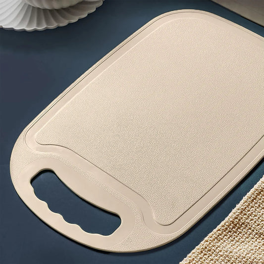 Light beige plastic chopping board with finger-grip handle, 34x23 cm