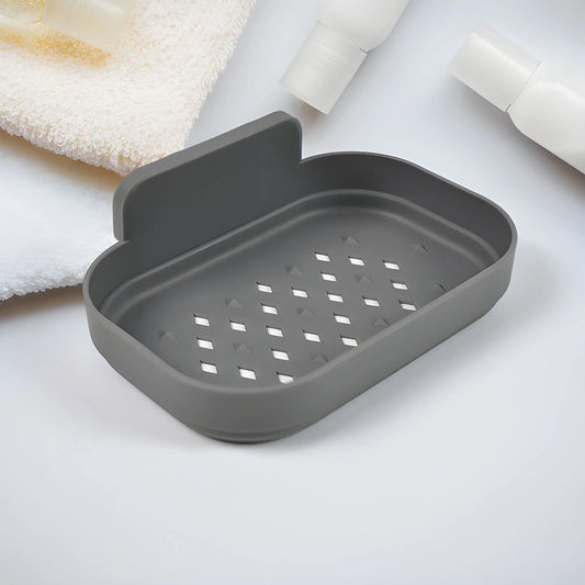 Dark gray soap dish with raised rim and drainage holes