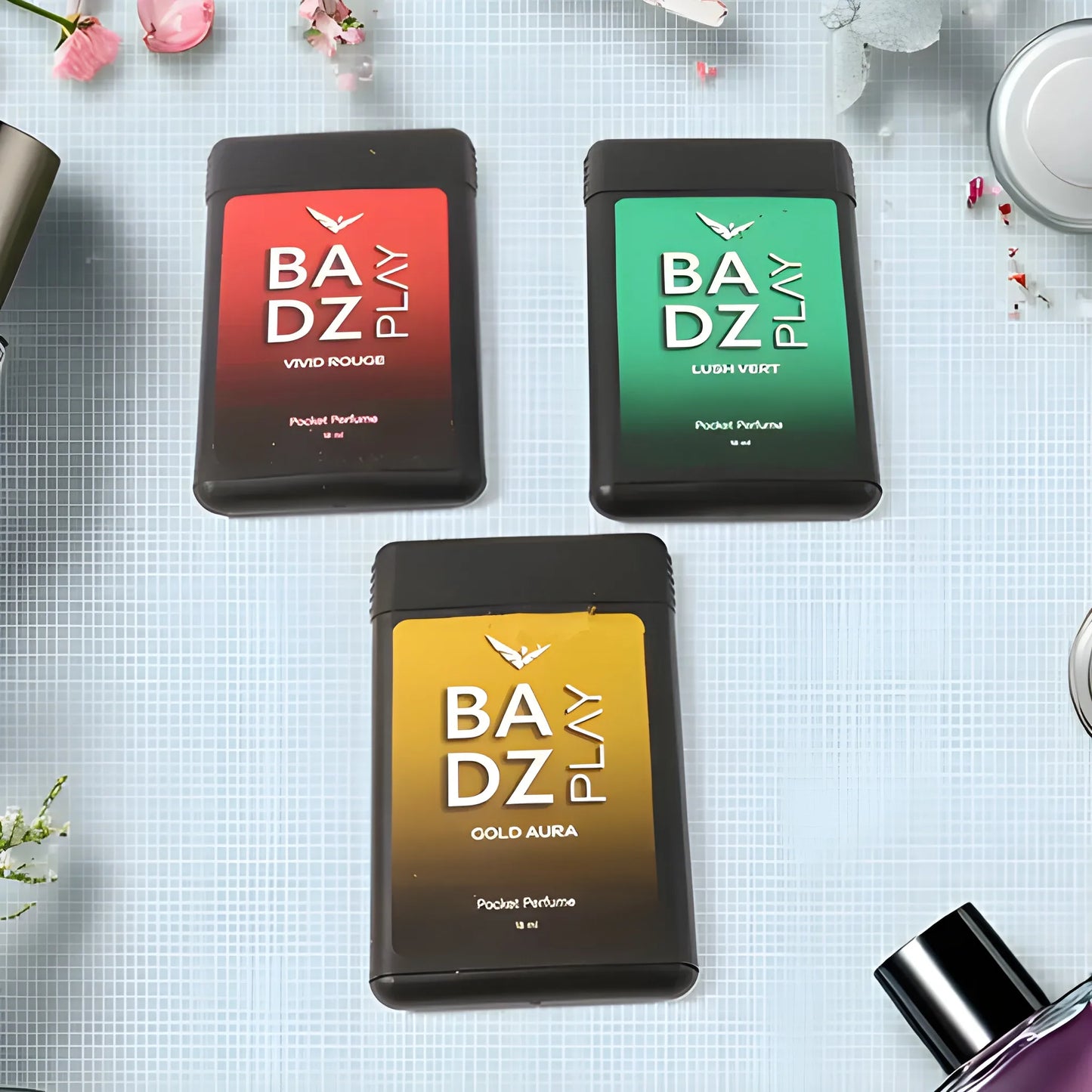 Pocket-sized men’s perfume bottles in red, green, and gold boxes