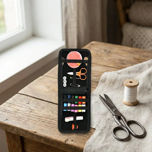 Portable emergency sewing kit with open black case, colorful thread, scissors, and spool
