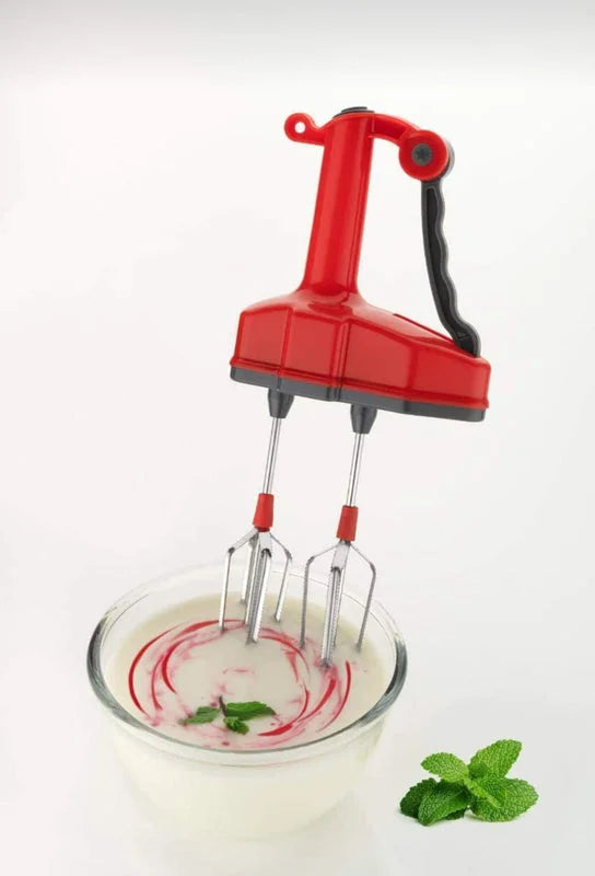 Red power free hand blender with whisk beaters, shown over mixing bowl