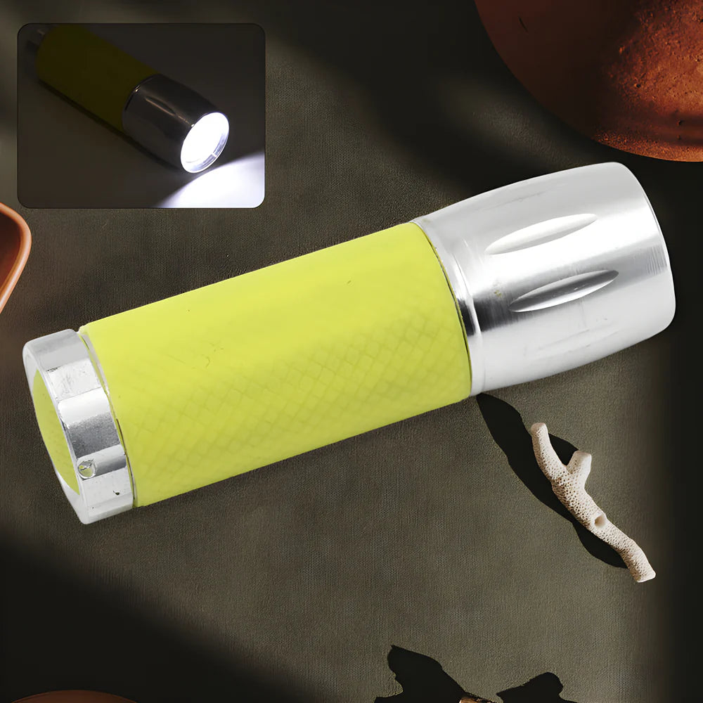 Mini torch light, lime green body, silver head, bright beam and wrist strap