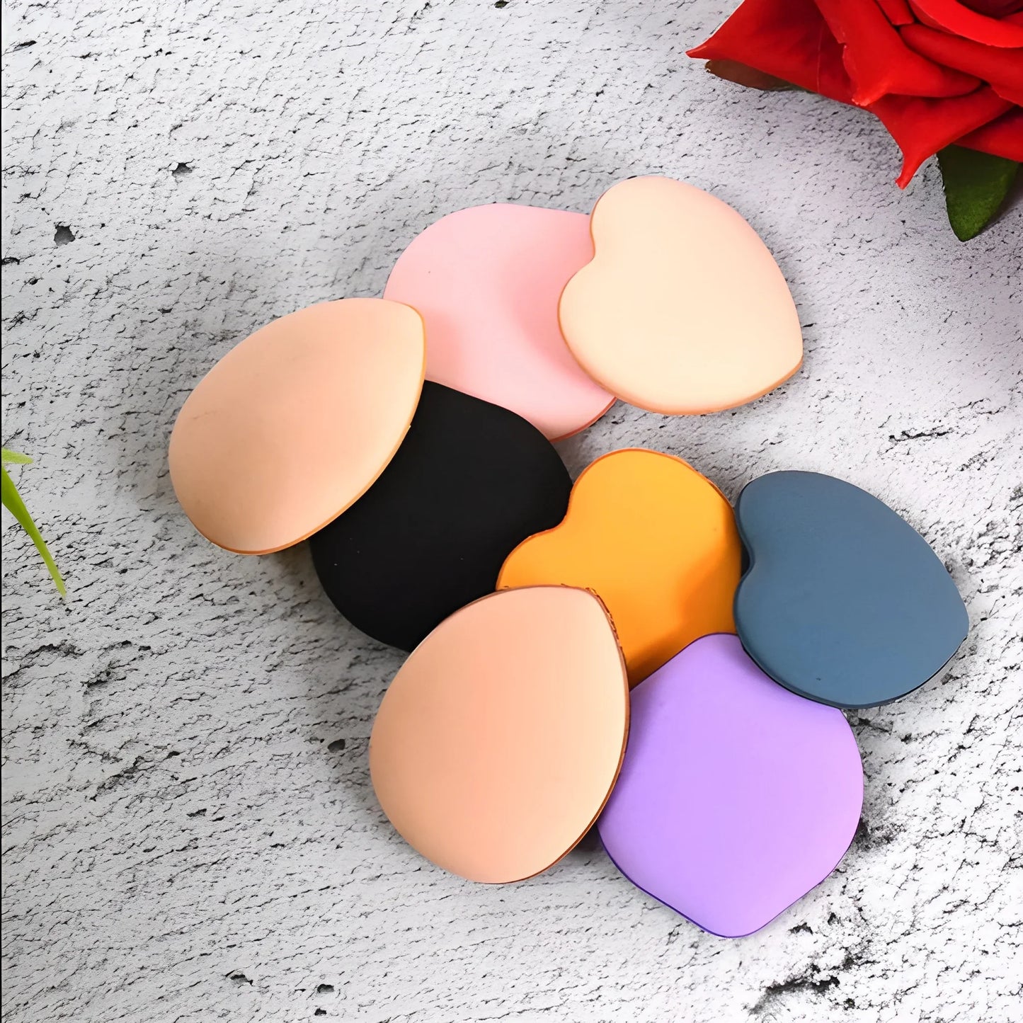 Heart-shaped finger makeup puffs, assorted colors: pink, peach, black, orange, blue, purple.