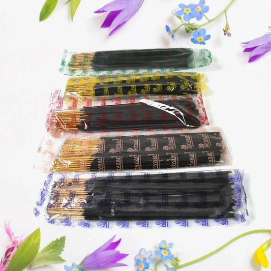 Agarbatti incense sticks bundle in clear sleeves, dark and light sticks