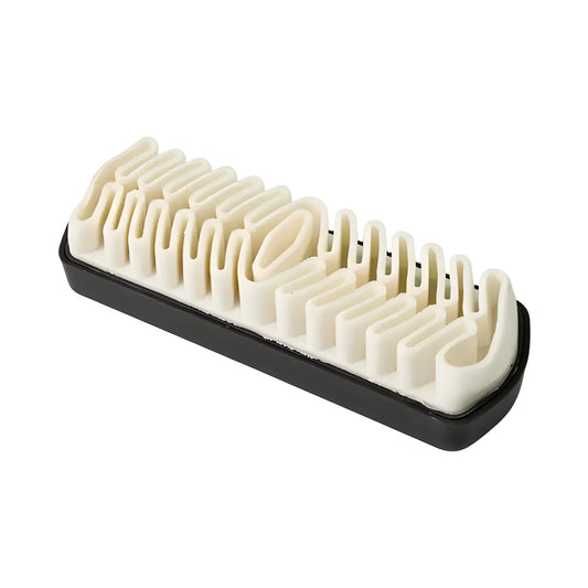 Cleaning brush with cream bristles on a black base