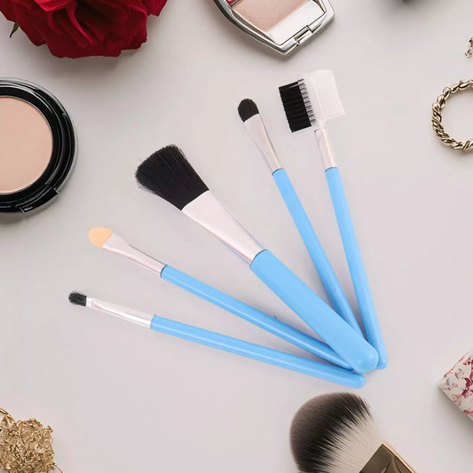 Makeup brush kit with blue handles and white bristles, multiple brush shapes