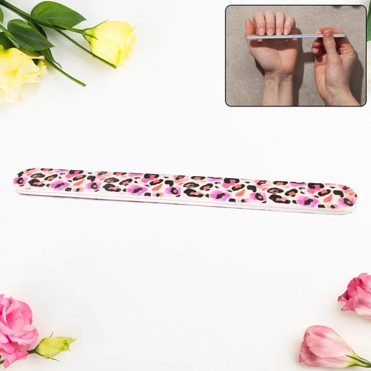 Pink leopard print nail file tool with textured sanding surface, slim rectangular shape