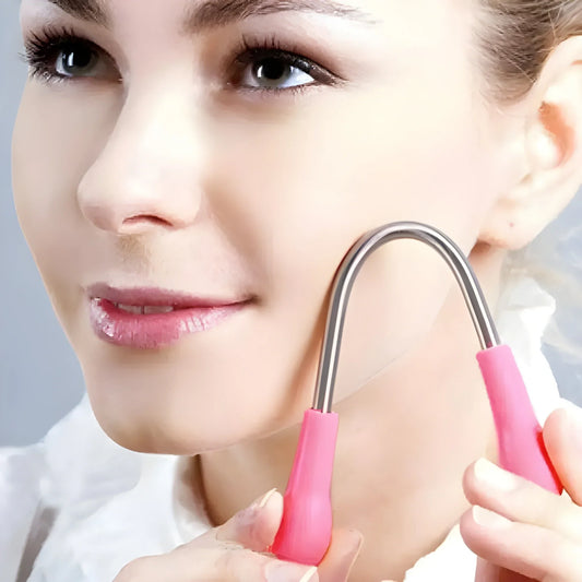 Nose wax applicator tool with pink handle and metal loop