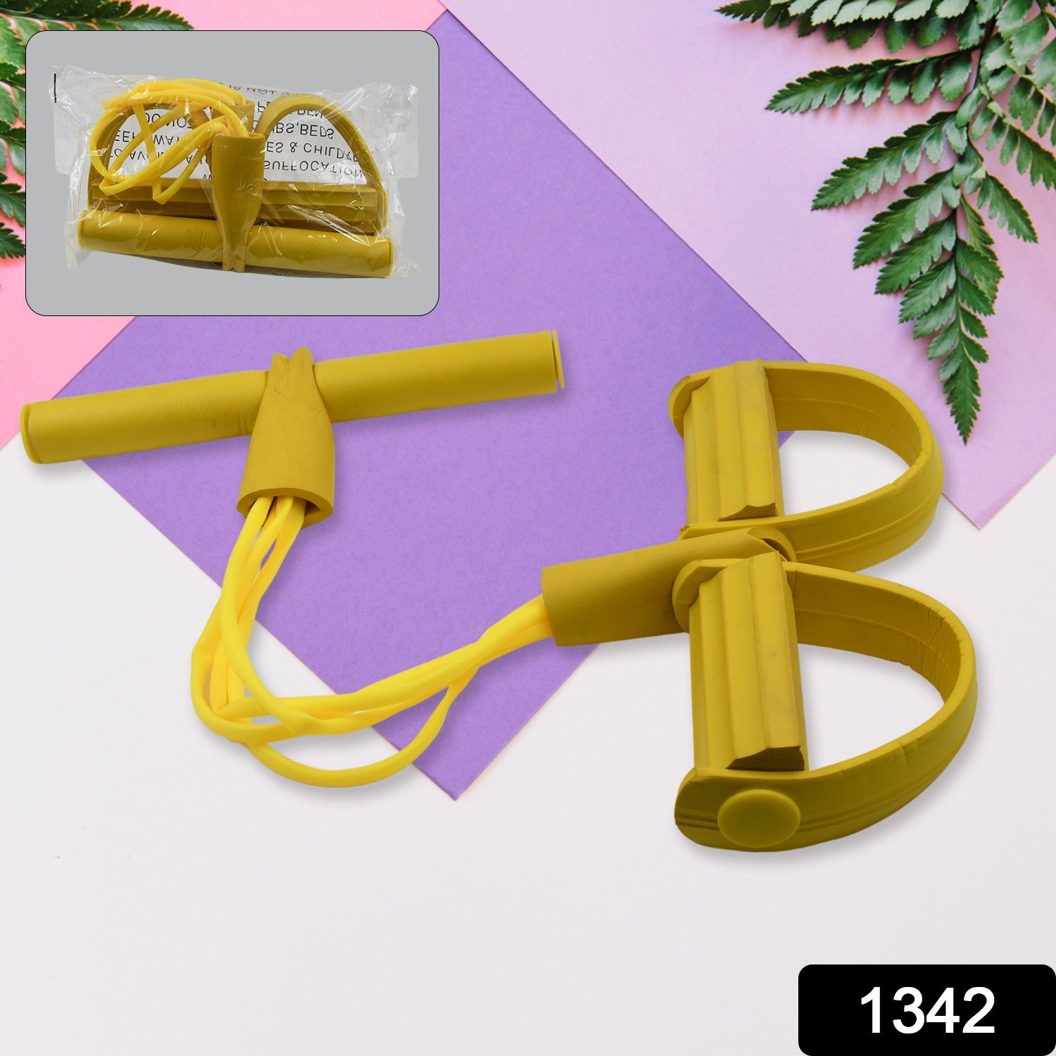 Yellow pull string exerciser with two circular handles and elastic pull cord