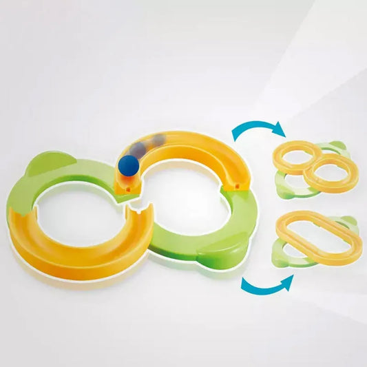 Race track construction toy set with yellow and green track loops and connector pieces
