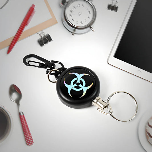 Black retractable keychain clip holder with blue biohazard icon