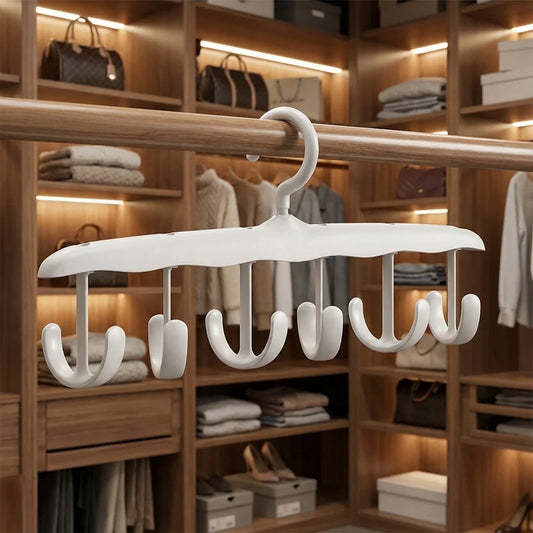Rotatable tank top hanger with curved arms and multiple hooks for hanging