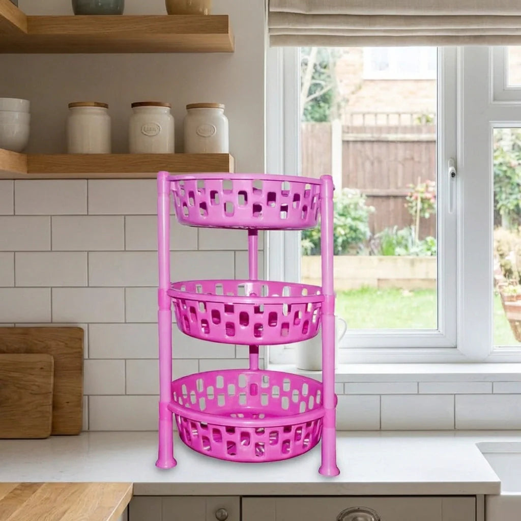 Purple 3-tier round plastic rack organizer with vented baskets, standing by a window.
