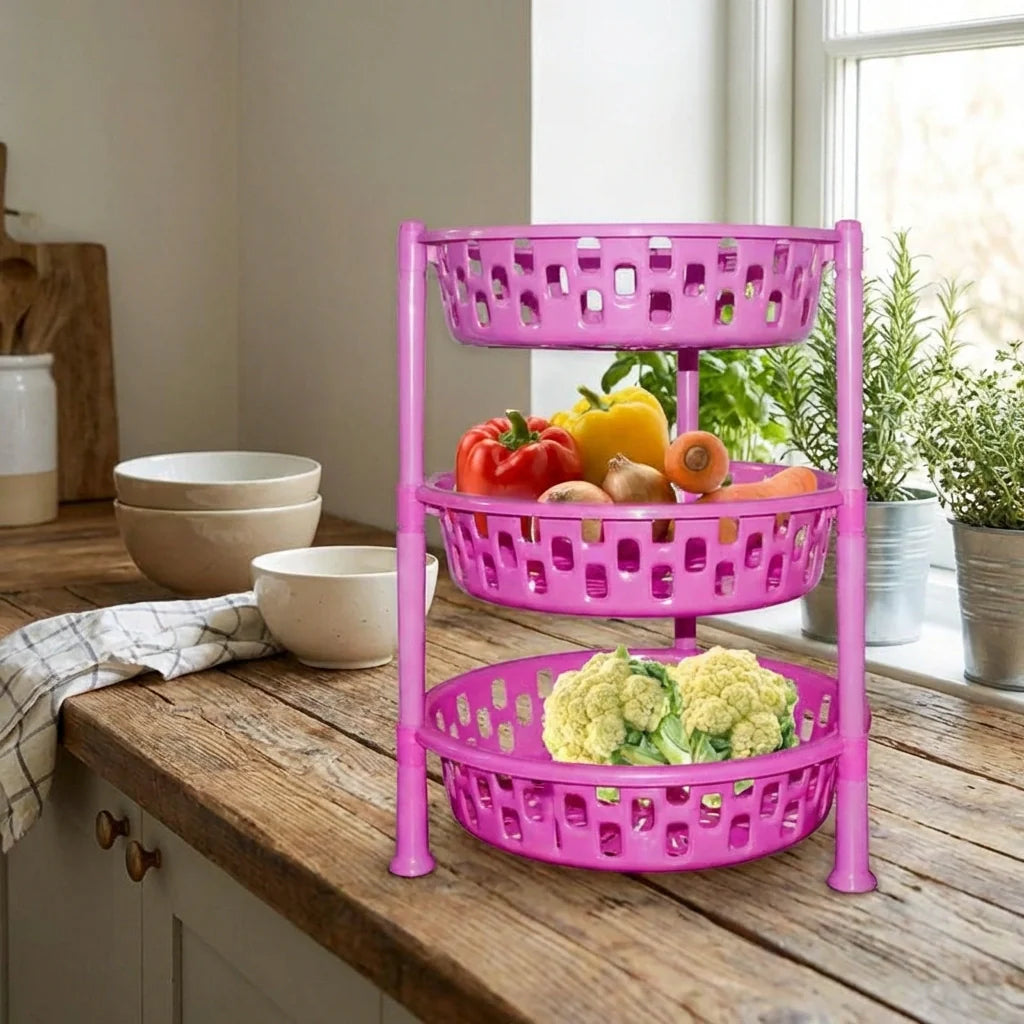 Purple 3-tier round plastic rack organizer with vented baskets holding fruits and vegetables.