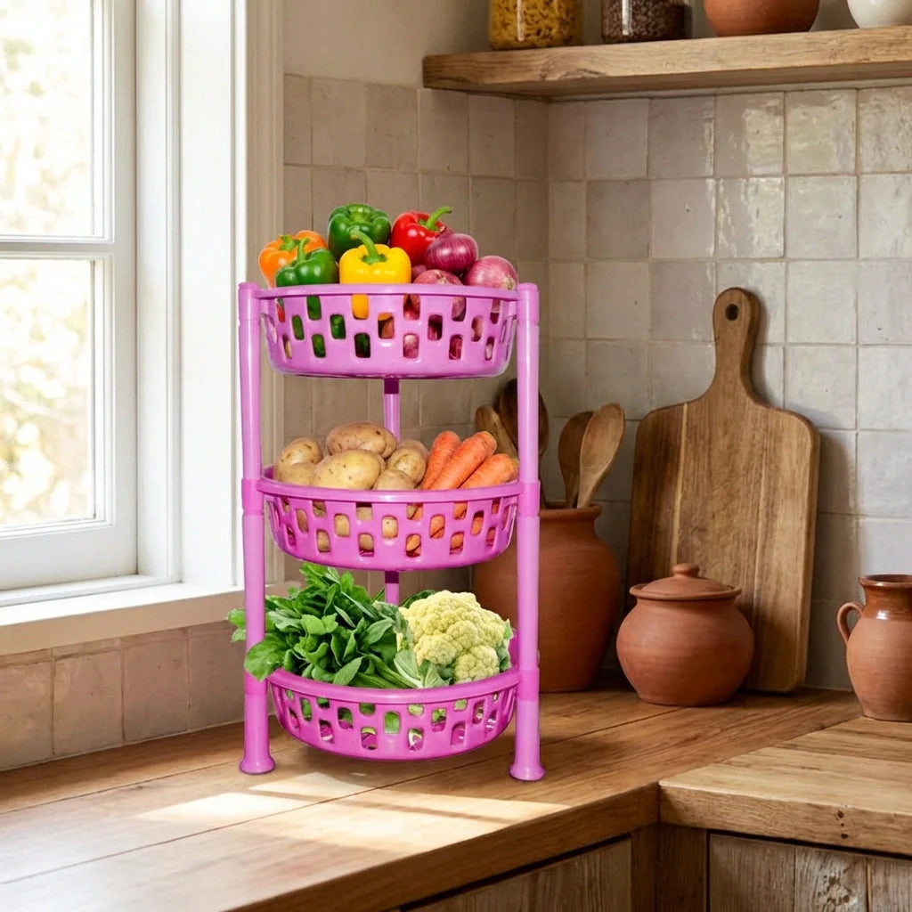Purple 3-tier round plastic rack organizer with vented baskets holding vegetables.