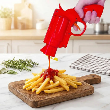 Red sauce dispenser gun pouring sauce onto fries on cutting board