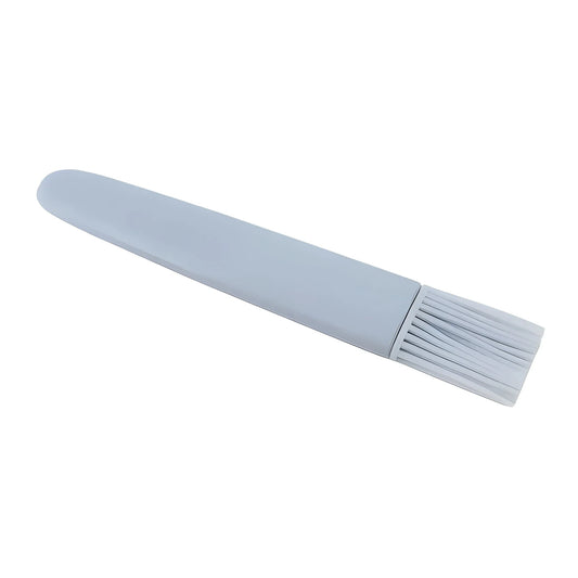 Light blue silicone basting brush with flexible bristles on a short handle