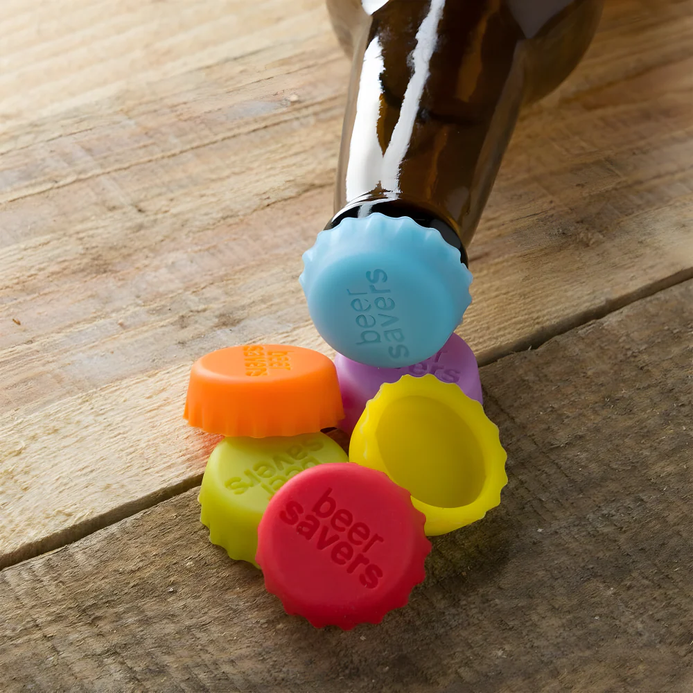 Silicone bottle saver caps in orange, yellow, blue, purple, and red silicone stoppers