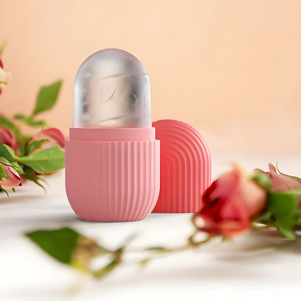 Silicone face ice roller with silver dome and pink ribbed base