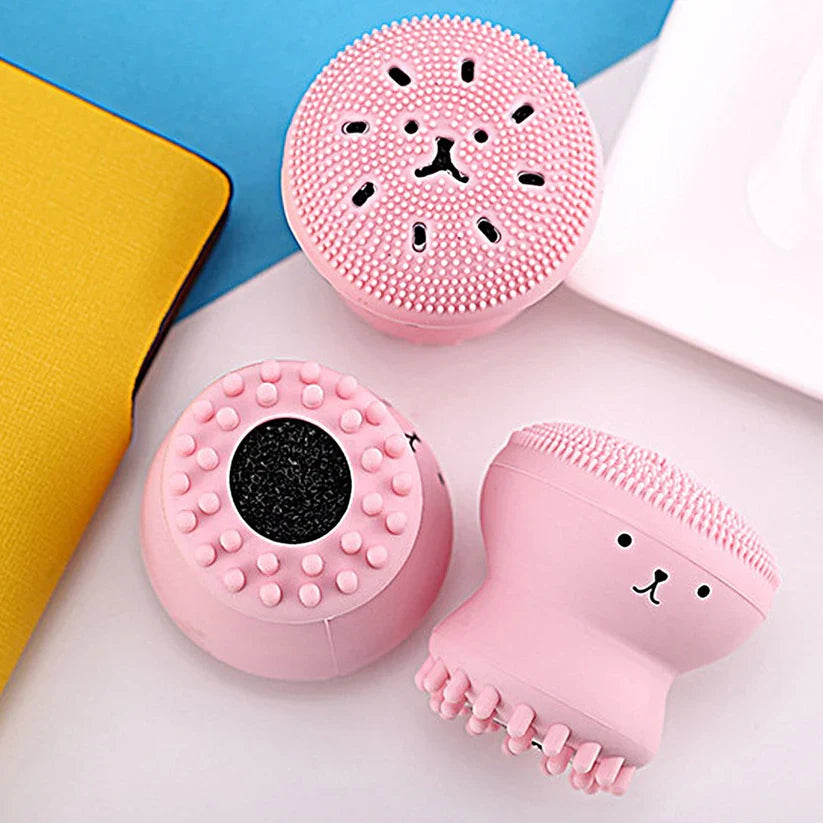 Pink silicone octopus face scrubber with raised dots and octopus face design
