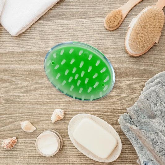 Green silicone scalp massager brush with raised nodules for gentle massage