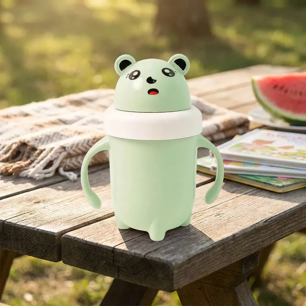 Light green panda baby sipper cup with round lid and two side finger handles.