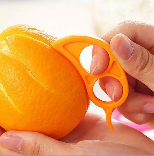 Orange peeler with snail-shaped handle, shown in orange fruit grip