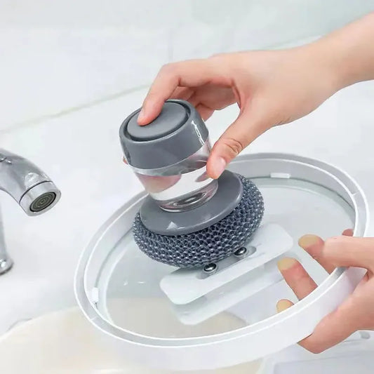 Gray soap dispenser palm brush with textured scrubbing pad