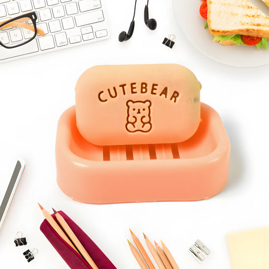 Orange soap eraser with plastic case, CuteBear bear logo on top